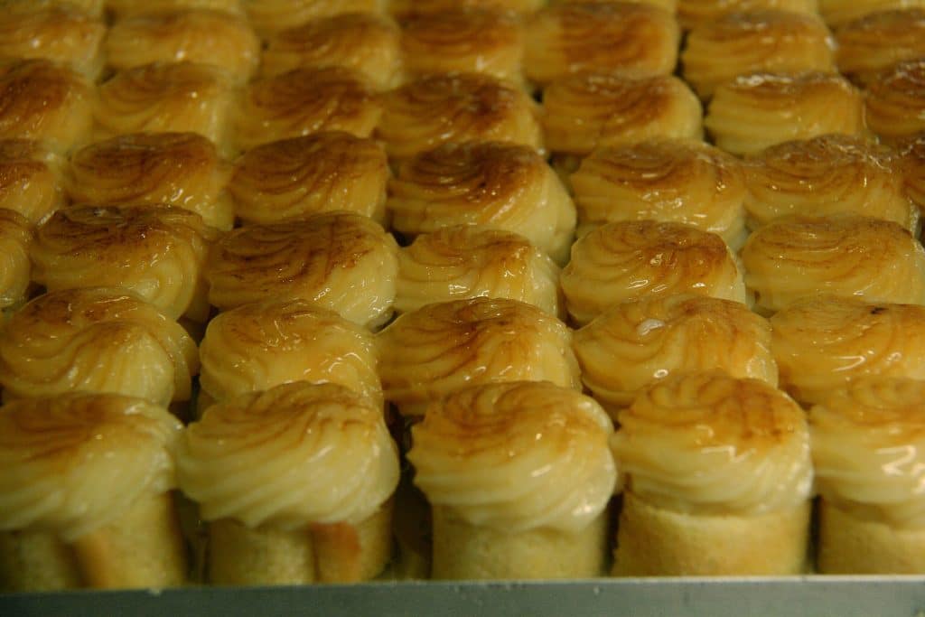 Close-up of Santa Fe piononos with toasted cream and syrup.